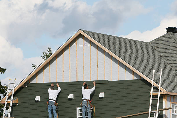 Professional Storm Damage Siding Repair technician working in Edinburg, IL